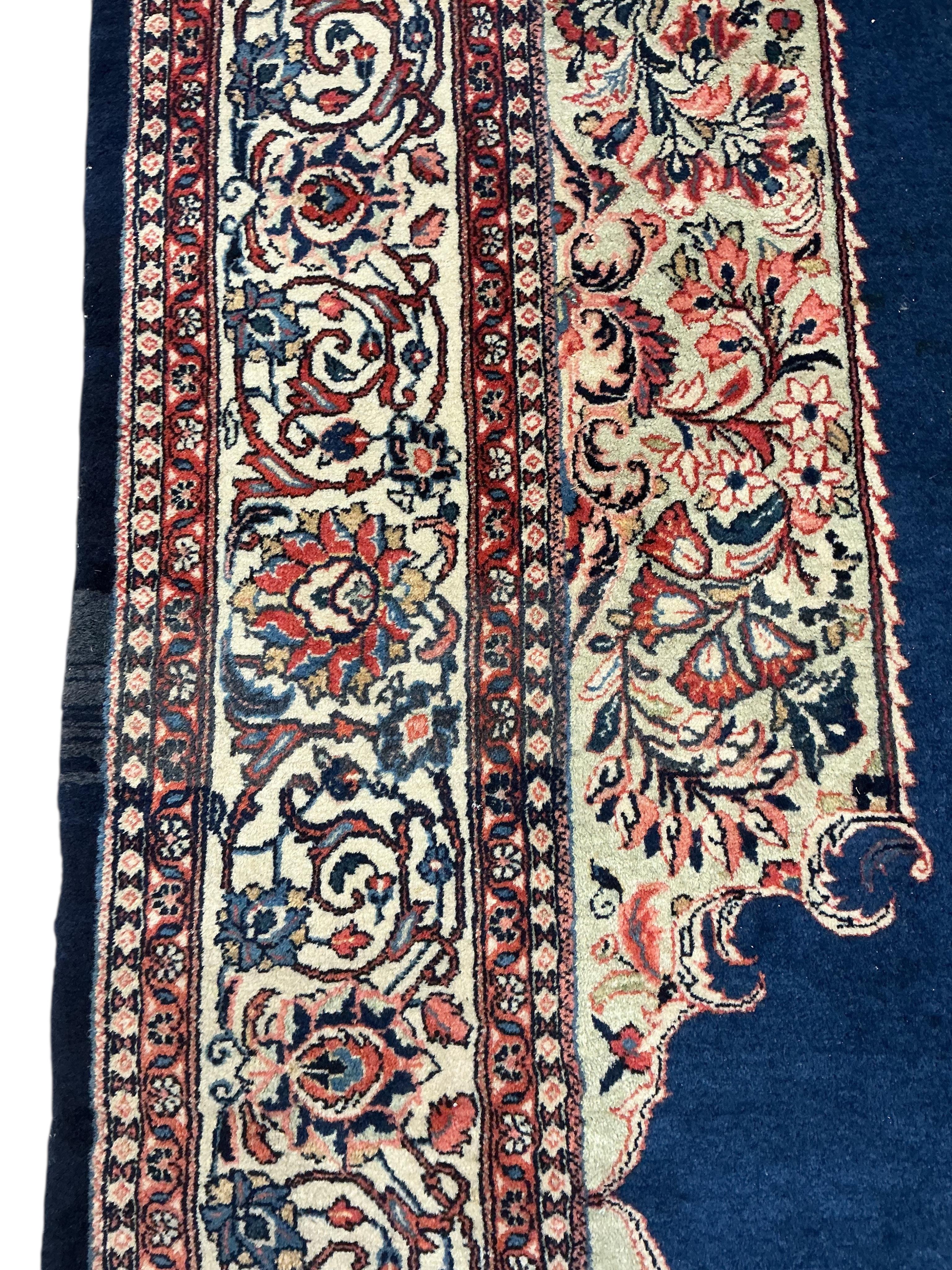 A Sarouk blue ground carpet, 320 x 210cm